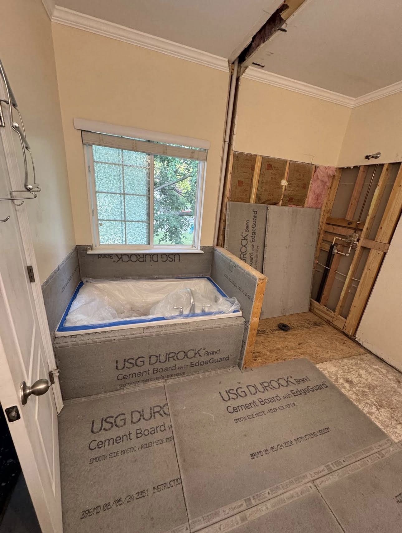 Bathroom preparation with exposed framing and cement board